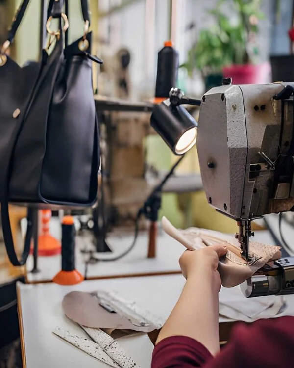 Worker Sewing Leather Handbag in Vixen Leather Company